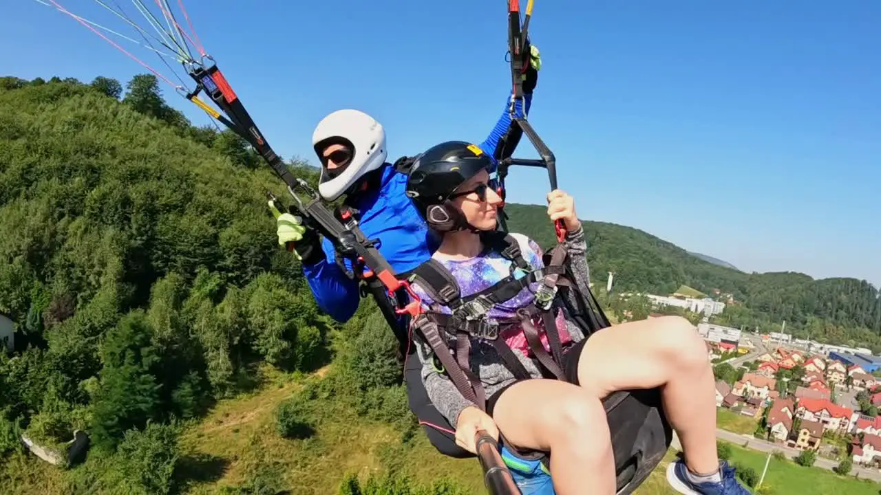 Tandem Paragliding Adventure with a Thrilling Experience Overlooking the Beautiful Landscapes of Brasov in Romania