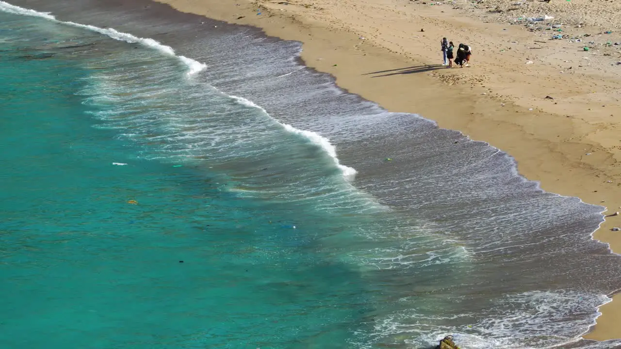 People cleaning beach from plastic waste Vietnam coast garbage pollution issue