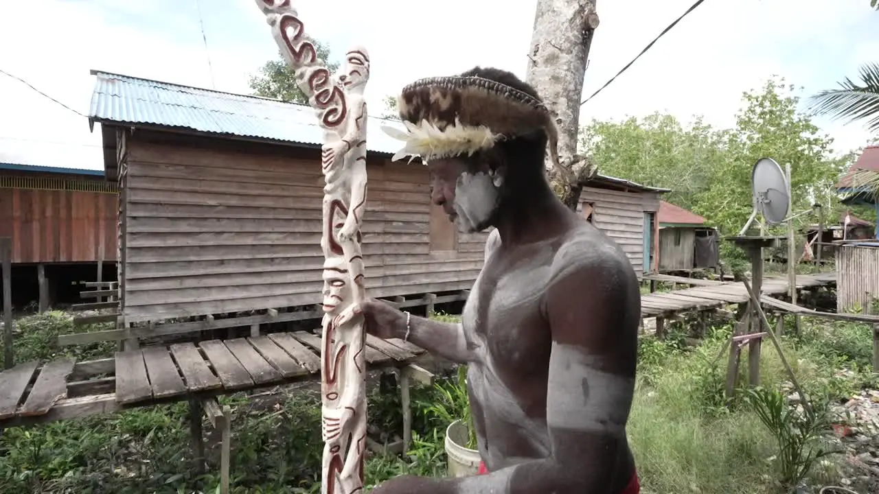 Pace checks the results of typical Papuan Asmat wood carvings