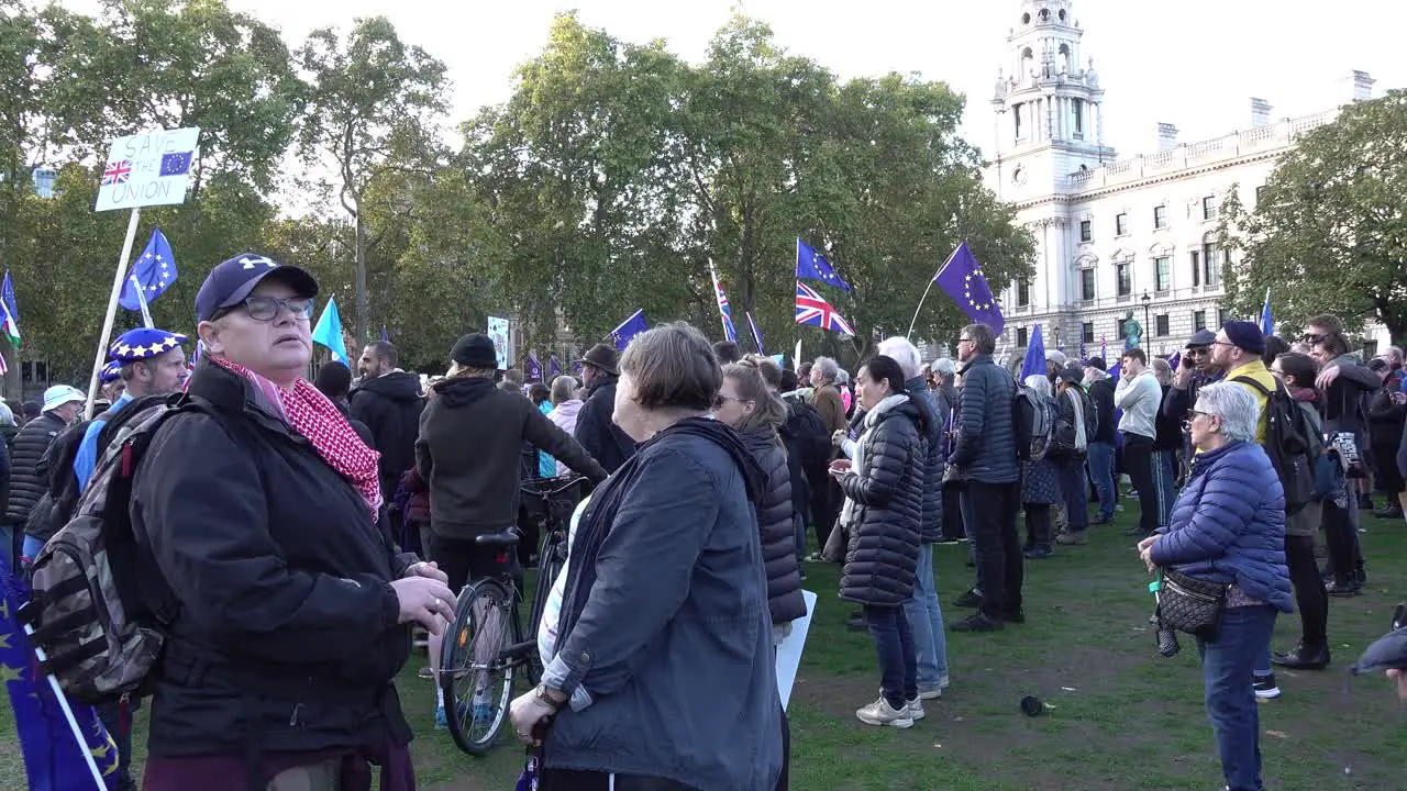 People listen to speeches at the People's Vote protests in London UK