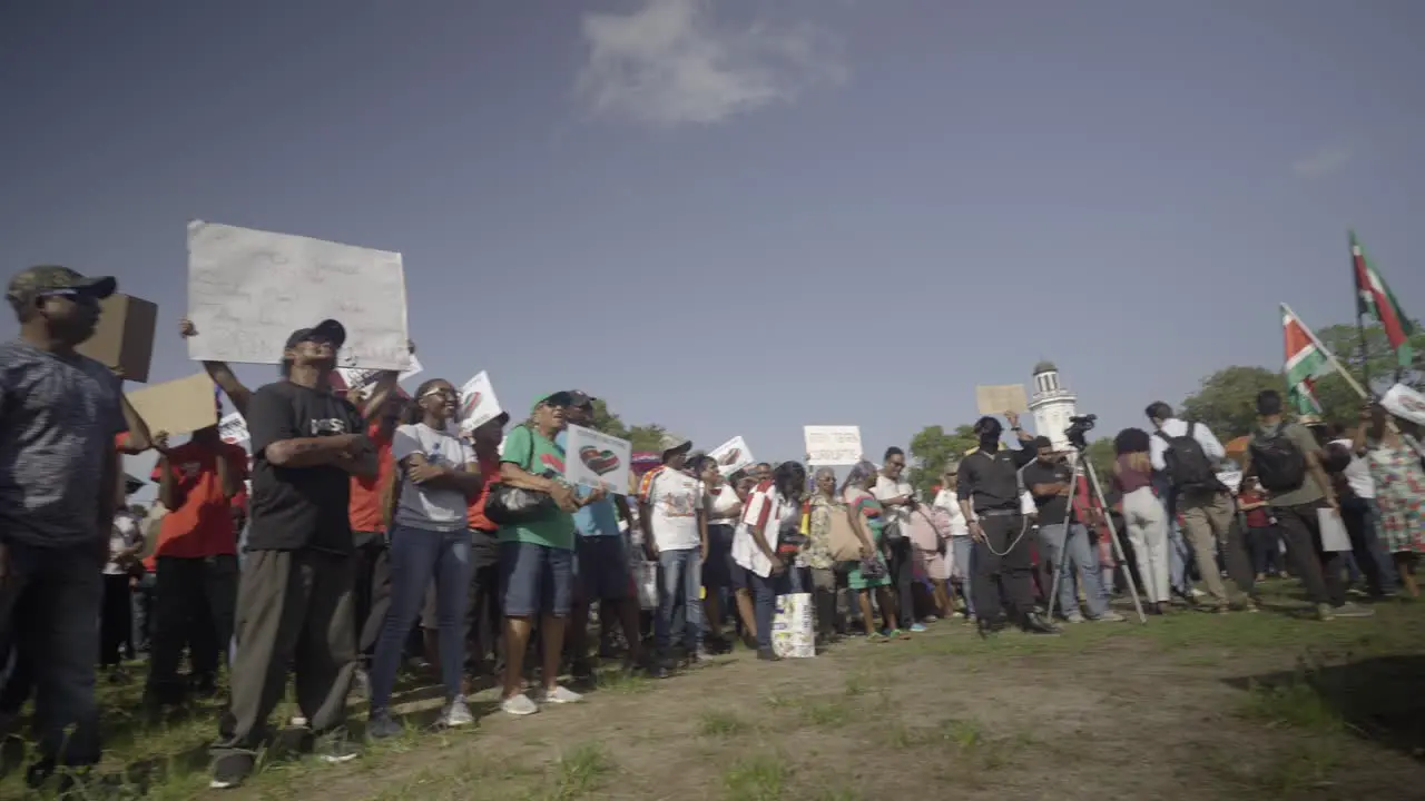 People protesting in Suriname against the government camera pan look around