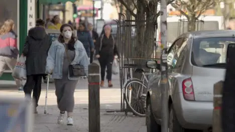 Woman wearing face mask walking on street