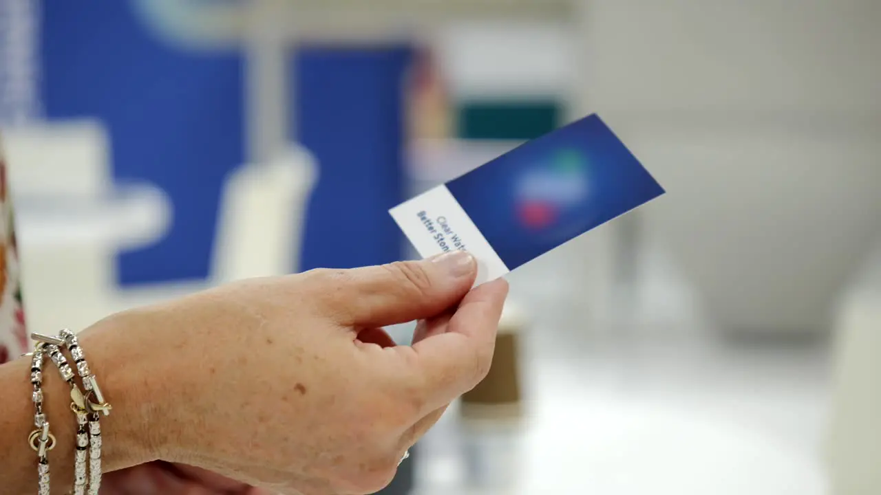 Close Up Of Person Sharing His Business Card With Another Gentleman