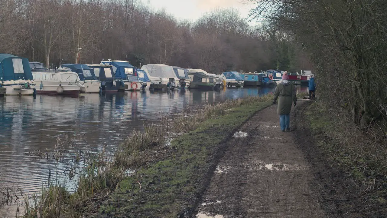 Back view of people walking along Castleford canal West Yorkshire in England