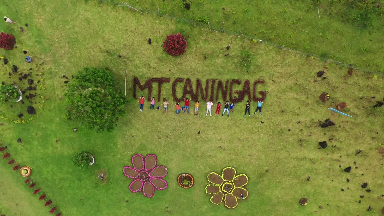 People Lying On Meadows At Caningag Mountain Park Known As The Little Batanes Of Southern Leyte Philippines