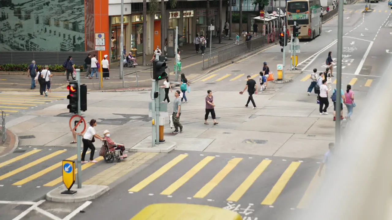 Busy pedestrian and car crossing in Hong Kong