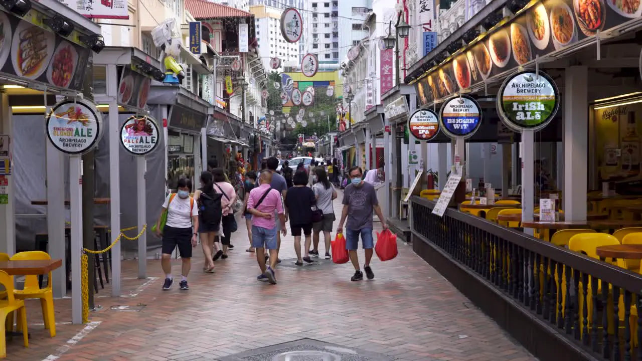 People wearing face mask walking in Chinatown