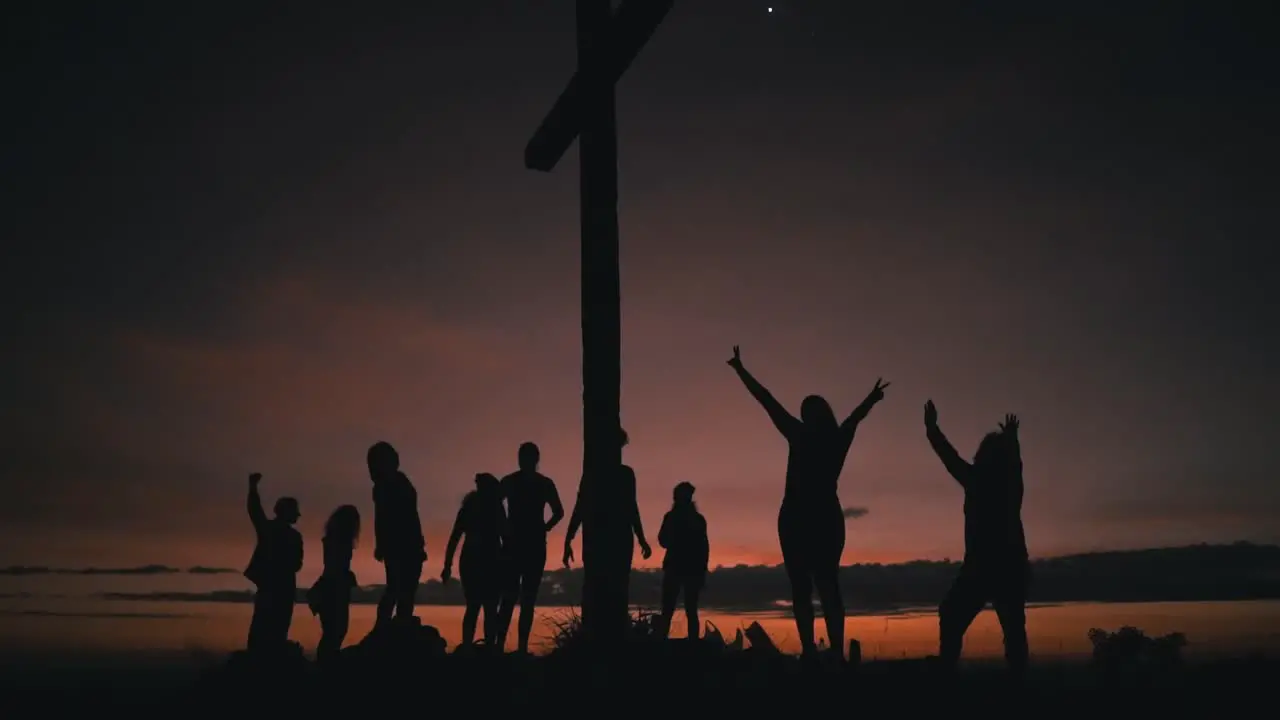 People jumping in slow motion during sunrise