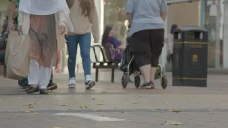 Defocused Shot of Feet Walking In Busy Street In Birmingham