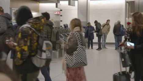 Commuters Passing Through Automated Ticket Barriers At Liverpool Street Tube Station London UK