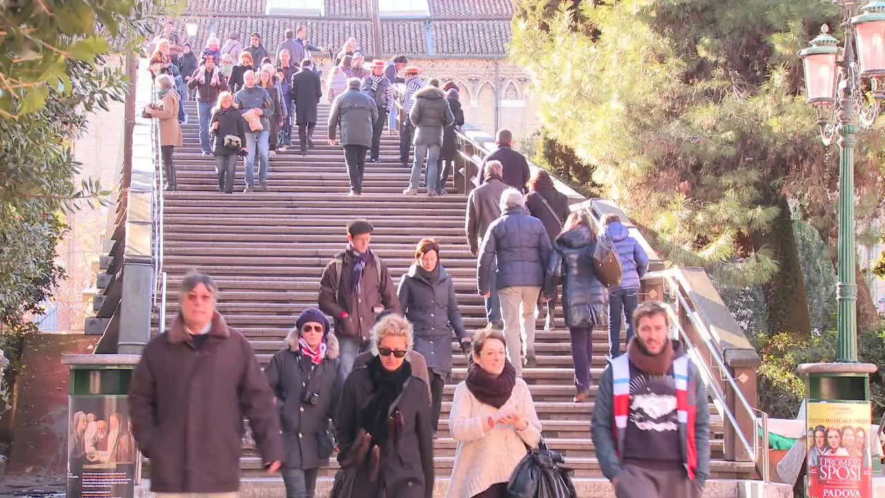 A time lapse of crowds crossing the Academia Bridge in Venice Italy