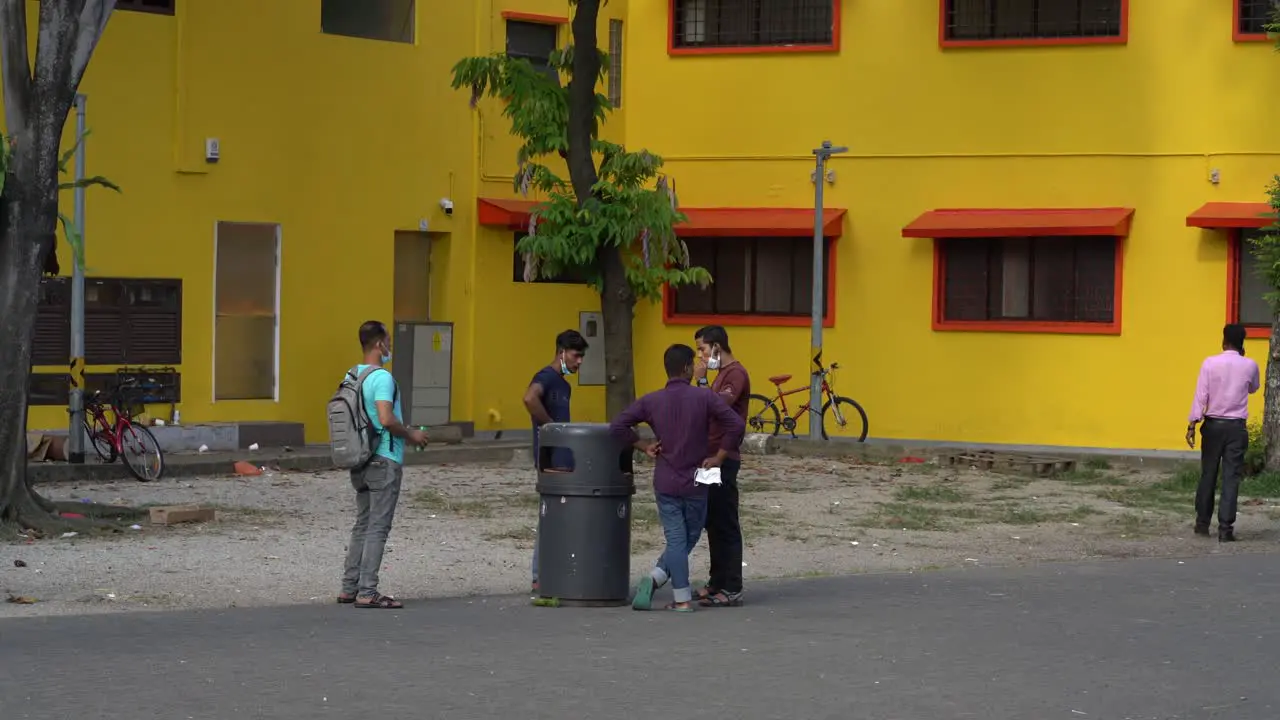 People smoking at public square in Little India Singapore