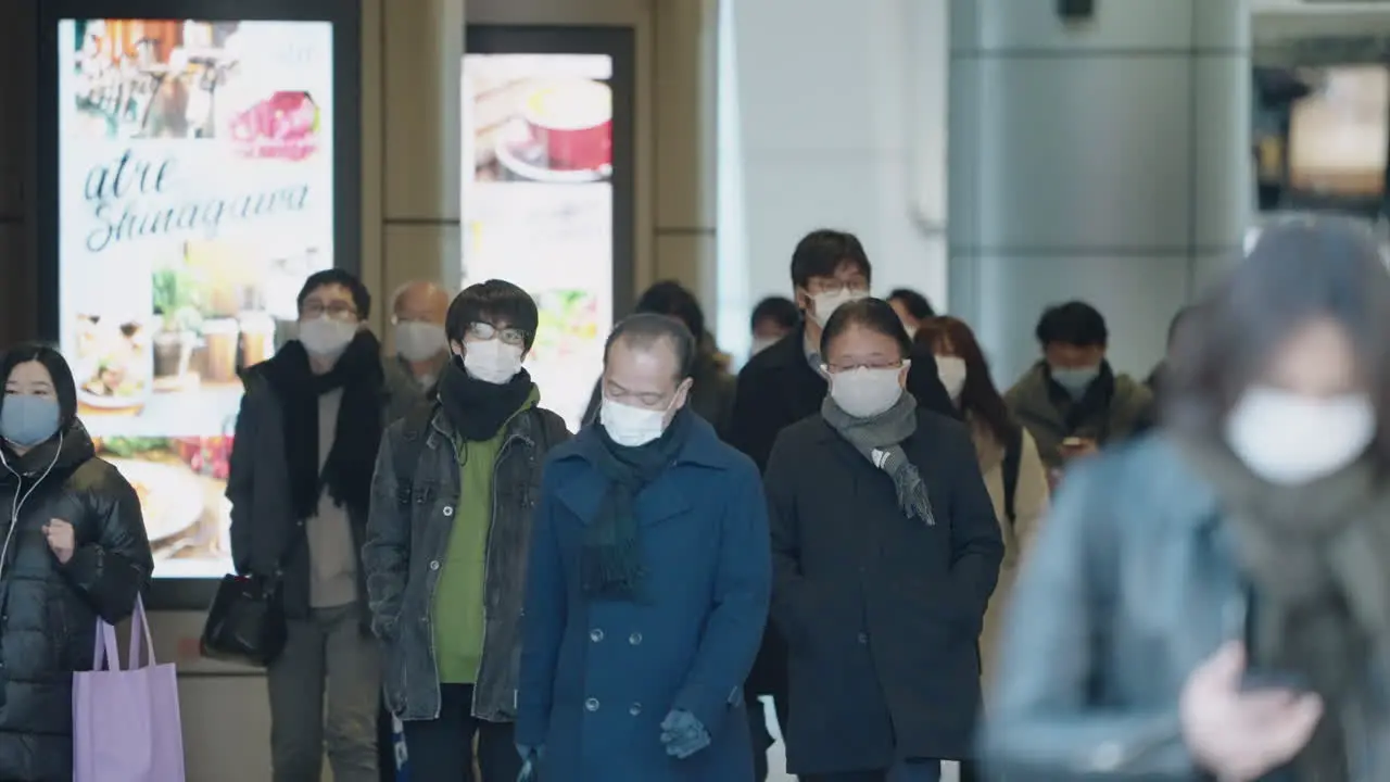 Commuters Exiting Shinagawa Station In Face Mask For Preventive Measure Due To New Strain Of COVID-19 In Tokyo Japan