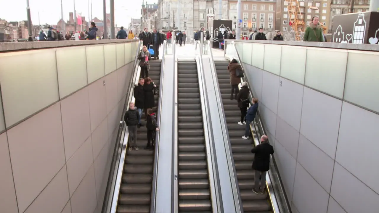 People On Escalator Entering And Exiting At Amsterdam Centraal Station In Amsterdam North Holland Netherlands