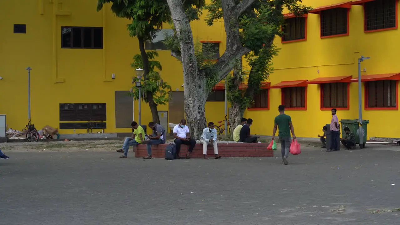 Group of people chatting and socialising at public square in Little India  Singapore