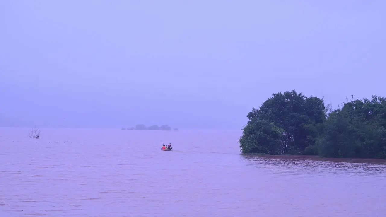 Rescue Boat Navigating a Flooded Lake in Thailand