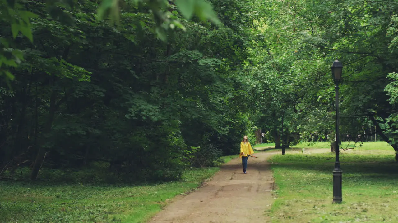 Woman Walking In A Beautiful Park