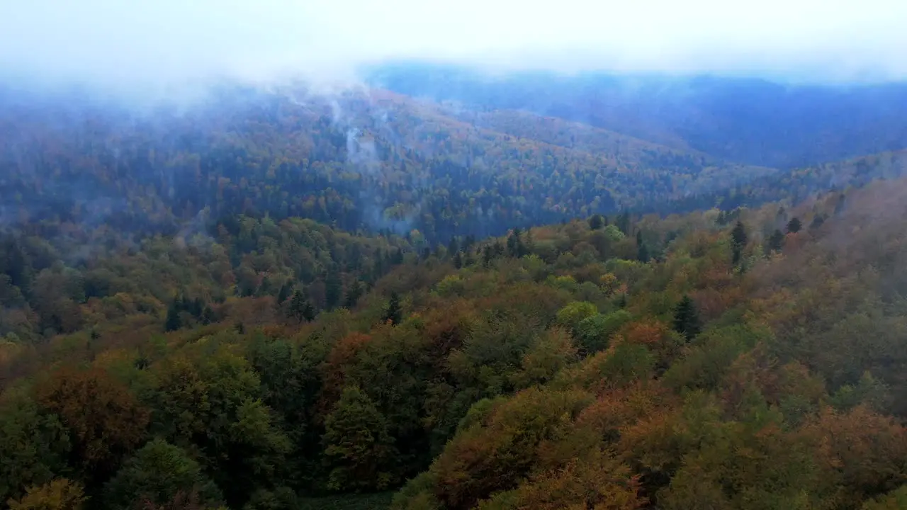 Dreamy Aerial View Of Mountain In Clouds