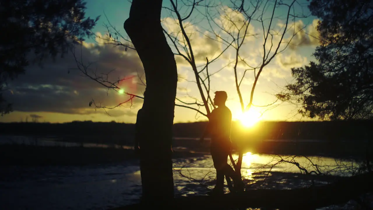 Friends hanging out enjoying sunset in the forest