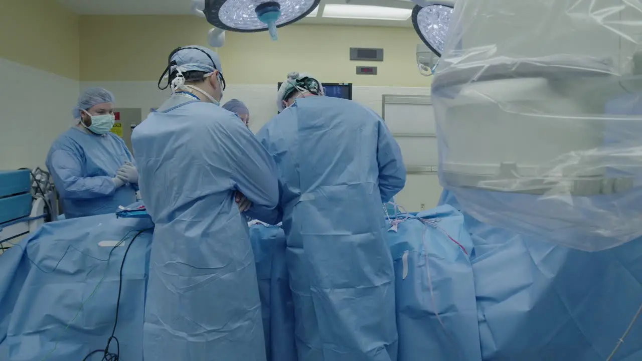 Medical team performs surgery in operating room