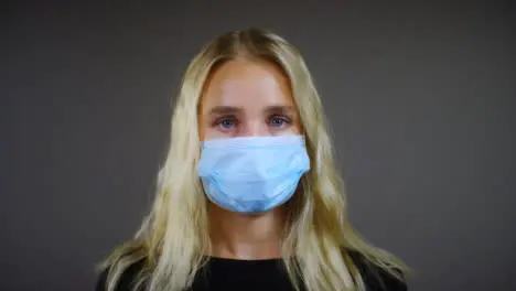 Young Blonde Woman Wearing Face Mask