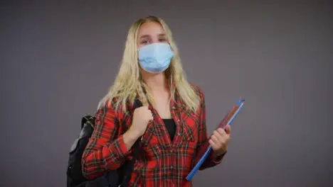 Young Blonde Female Student Wearing Face Mask