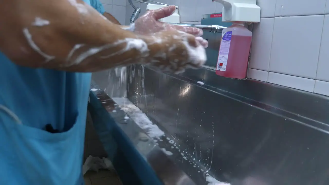 Surgeons are scrubbing their hands before surgery