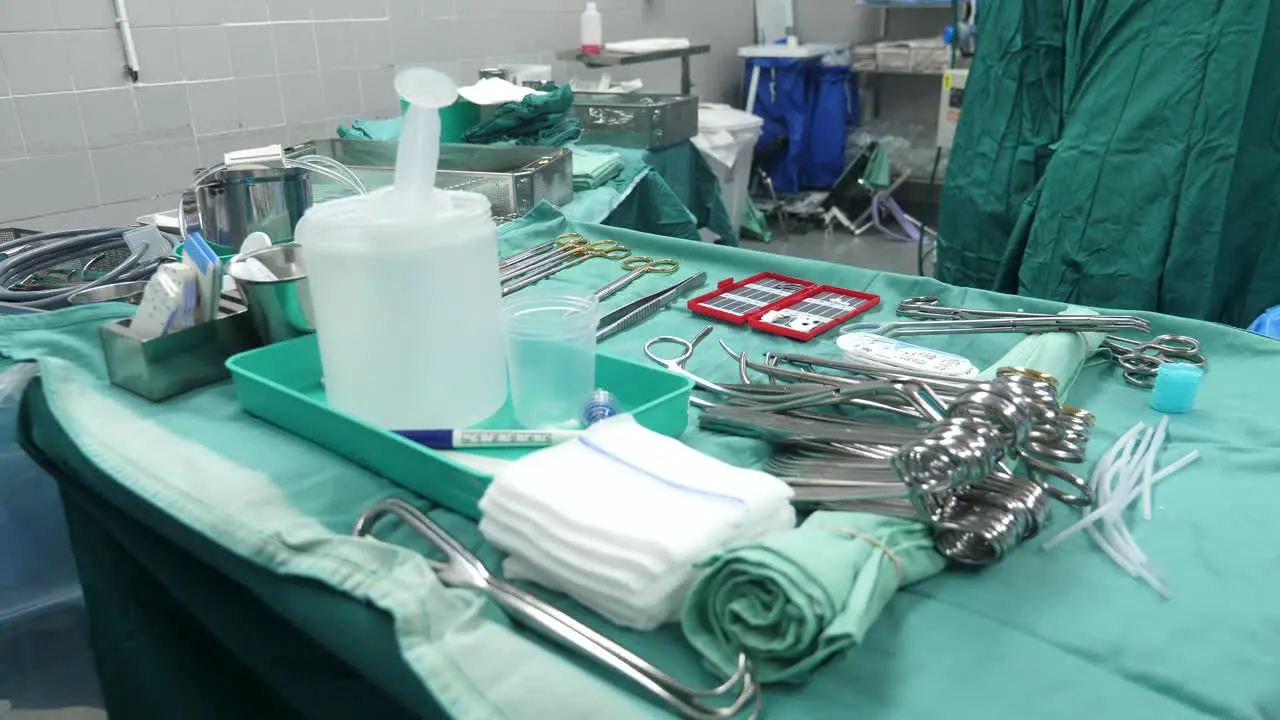 The operating room nurse is exchanging scalpel handles and blades during the heart transplant surgery