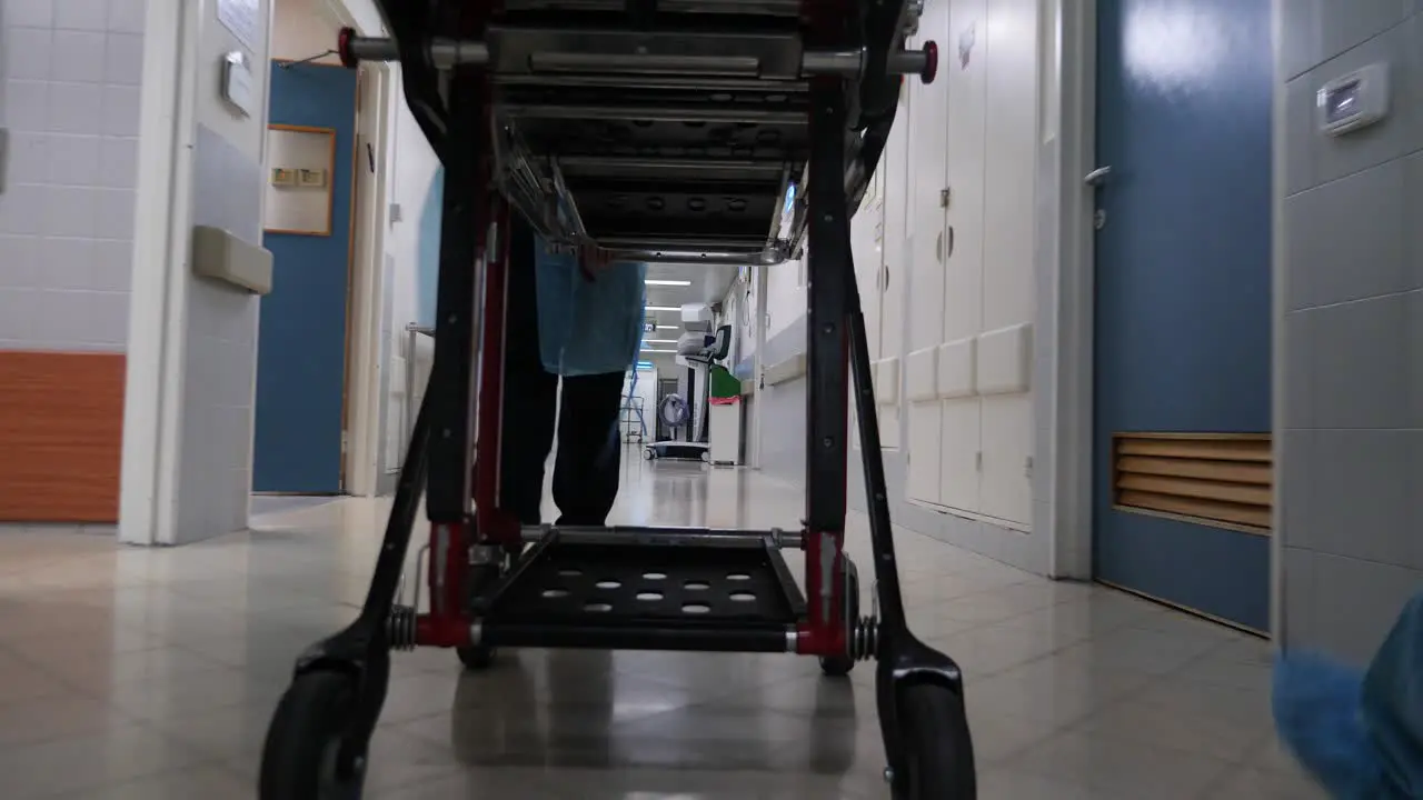 A stretcher being pushed urgently in the hospital corridors