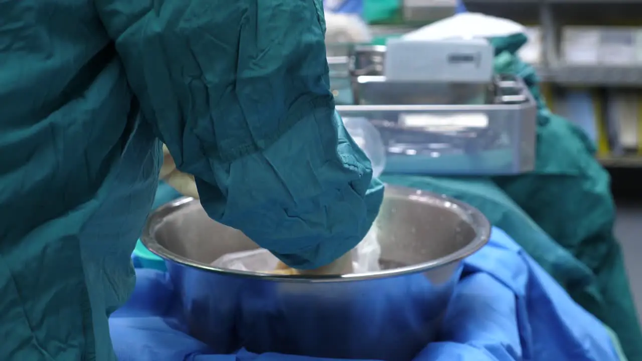 Analysis of a heart transplant where the surgeon removes the heart from the cooler and covers it with ice in preparation for the surgery