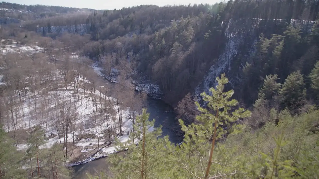 Wide Shot of River Running in a Forest Valley on a Bright Winter Day in Vilnius