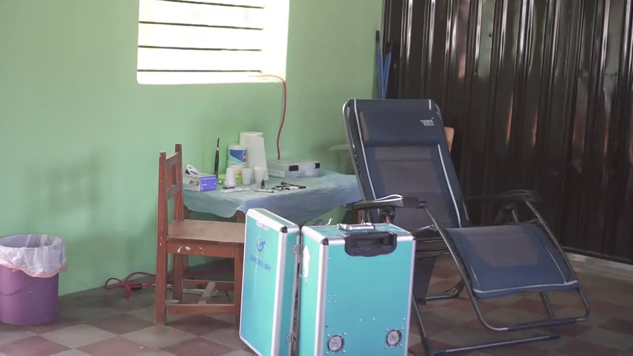 Chair and mobile dental equipment installed for a medical brigade in a poor community in an improvised clinic in a school