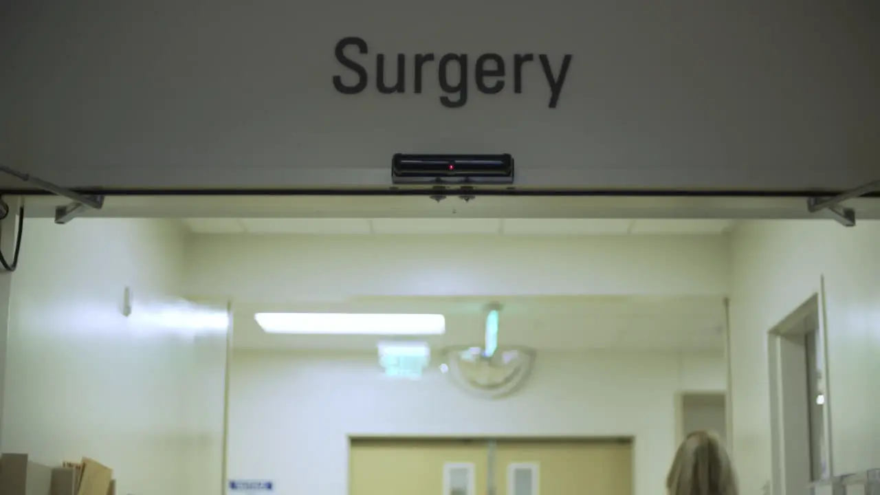 Doctor Walking Through Surgery Doors at Hospital Slow Motion 4K UHD