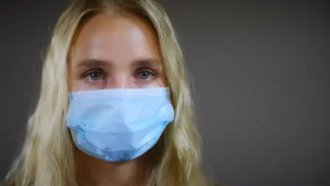 Young Blonde Woman Wearing Face Mask Pan