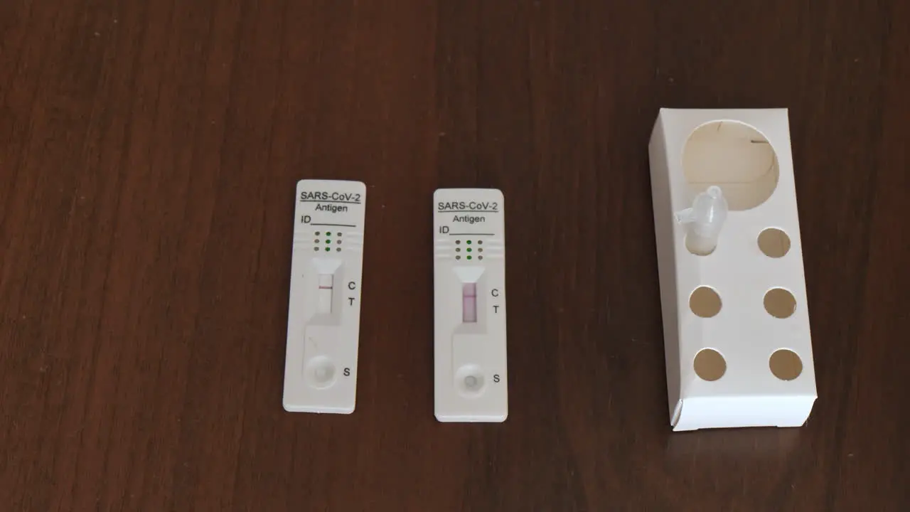 Rapid swab test lateral flow antigen for sars covid corona virus infection isolated on wooden desktop background