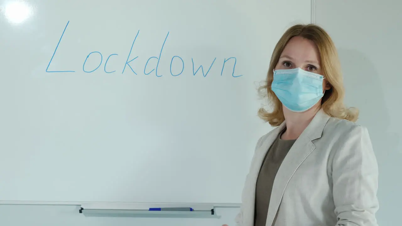 End Of Quarantine Woman Erases The Inscription Lockdown From The Classroom Board