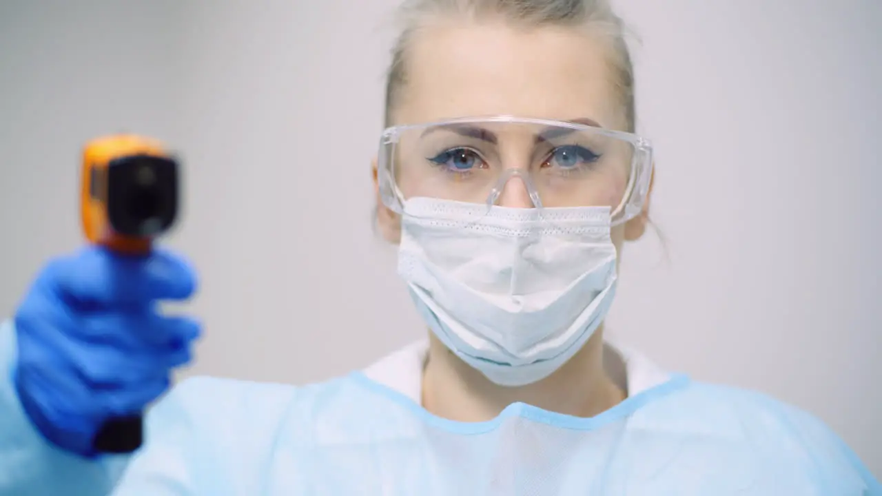 Doctor Measuring Patient Temperature At Health Care Clinic 1