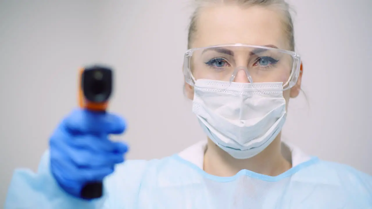 Doctor Measuring Patient Temperature At Health Care Clinic 2