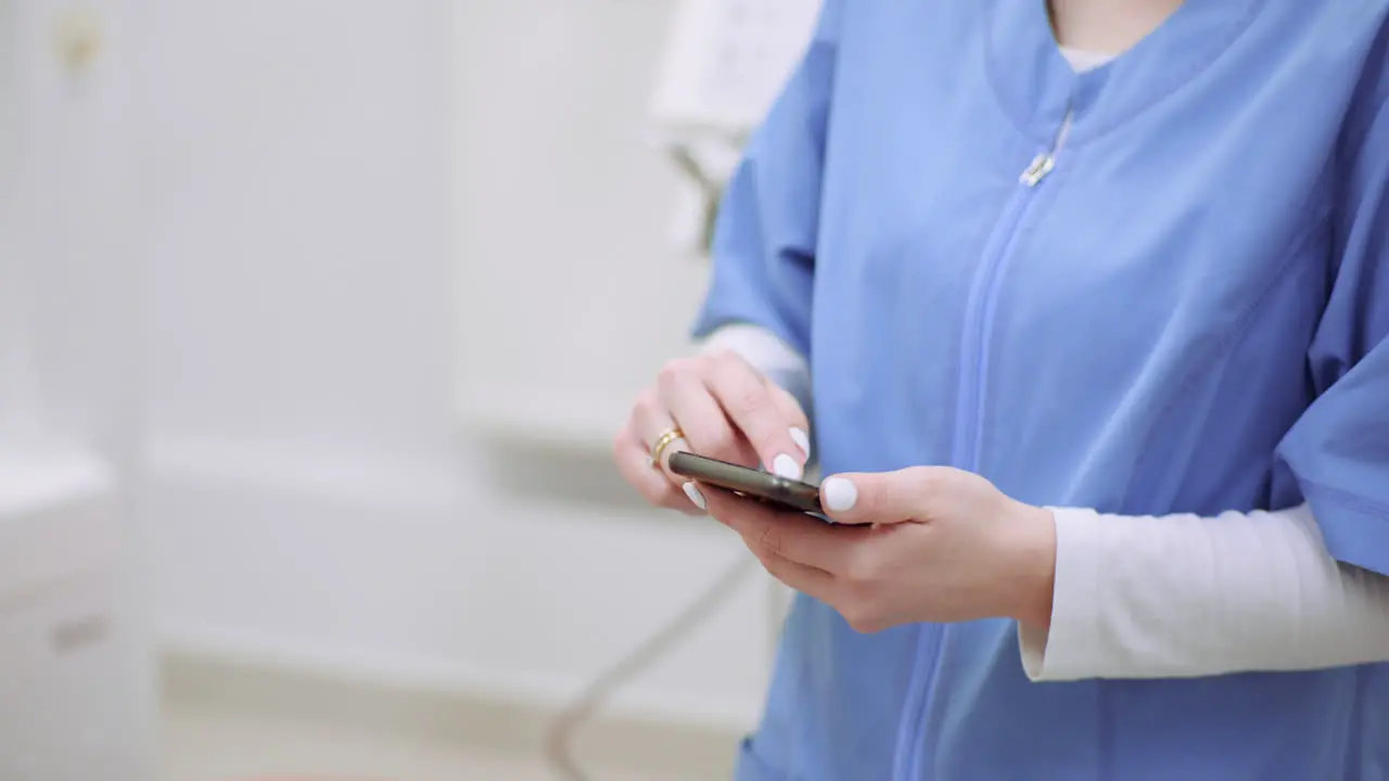 Female Doctor Using Mobile At Healthcare Clinic 2