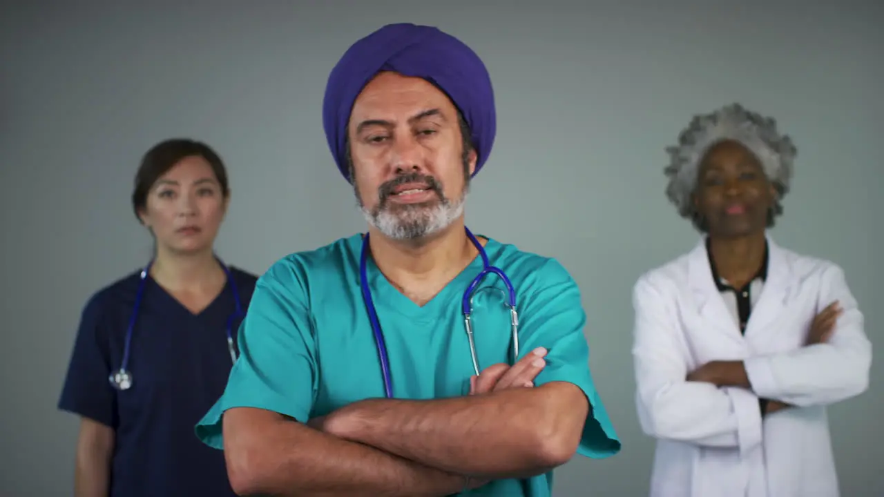 Pull Focus of Three Middle Aged Doctors Looking Concerned Portrait