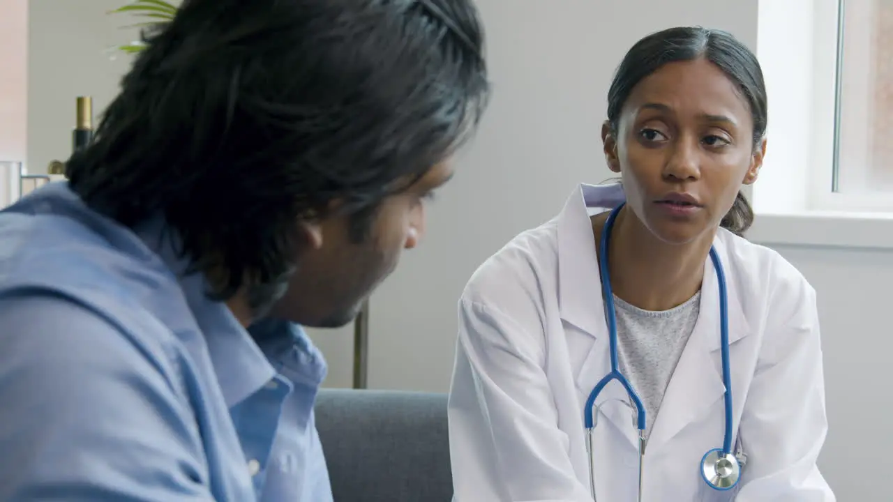 Young Doctor Telling Difficult News to Patient