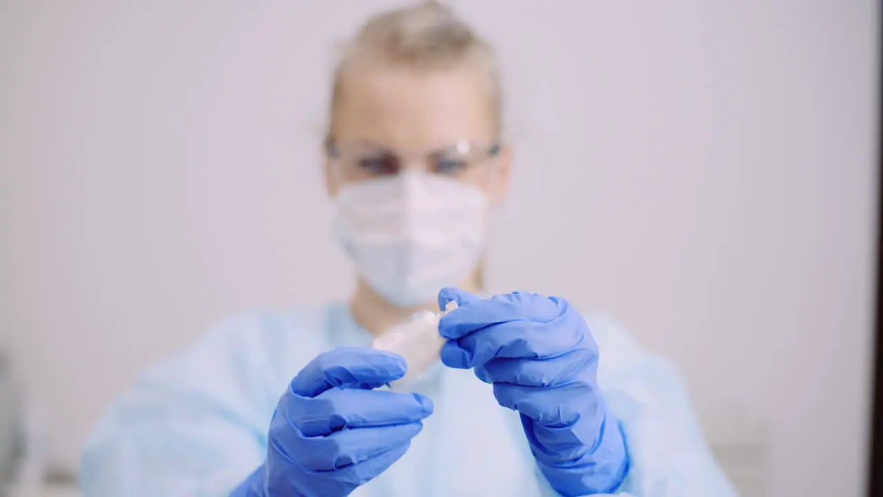 Doctor Holding And Examining Medicine In Hands