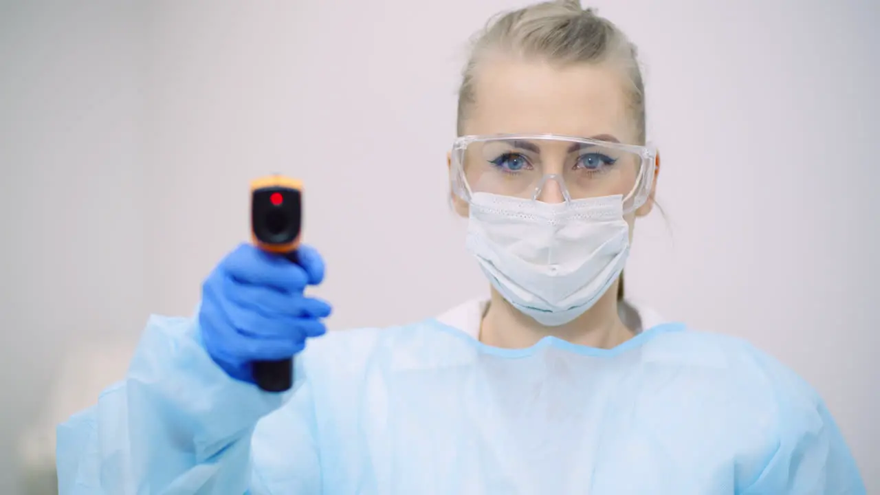 Doctor Measuring Patient Temperature At Health Care Clinic 6