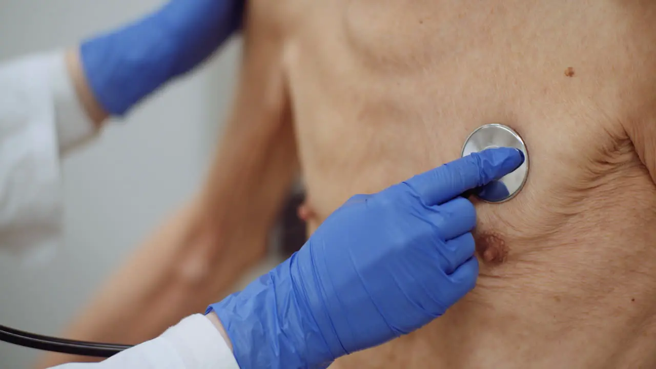 Female Doctor Examine Elderly Man With Stethoscope 3