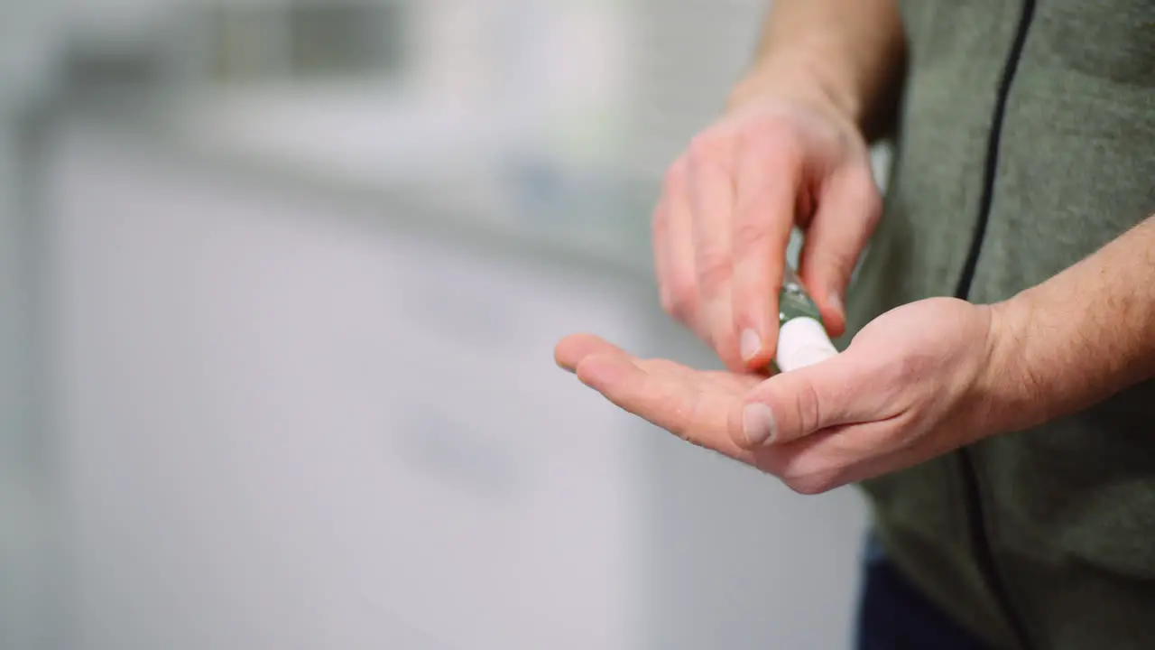 Man Disinfecting Hands With Antibacterial Gel