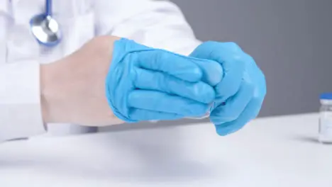 Close Up Shot of Medical Professional Removing Latex Gloves