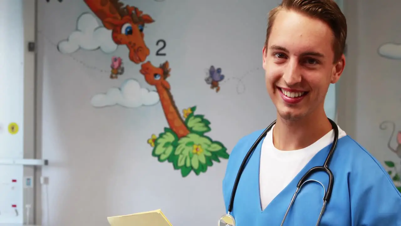 Smiling doctor holding medical report in hospital