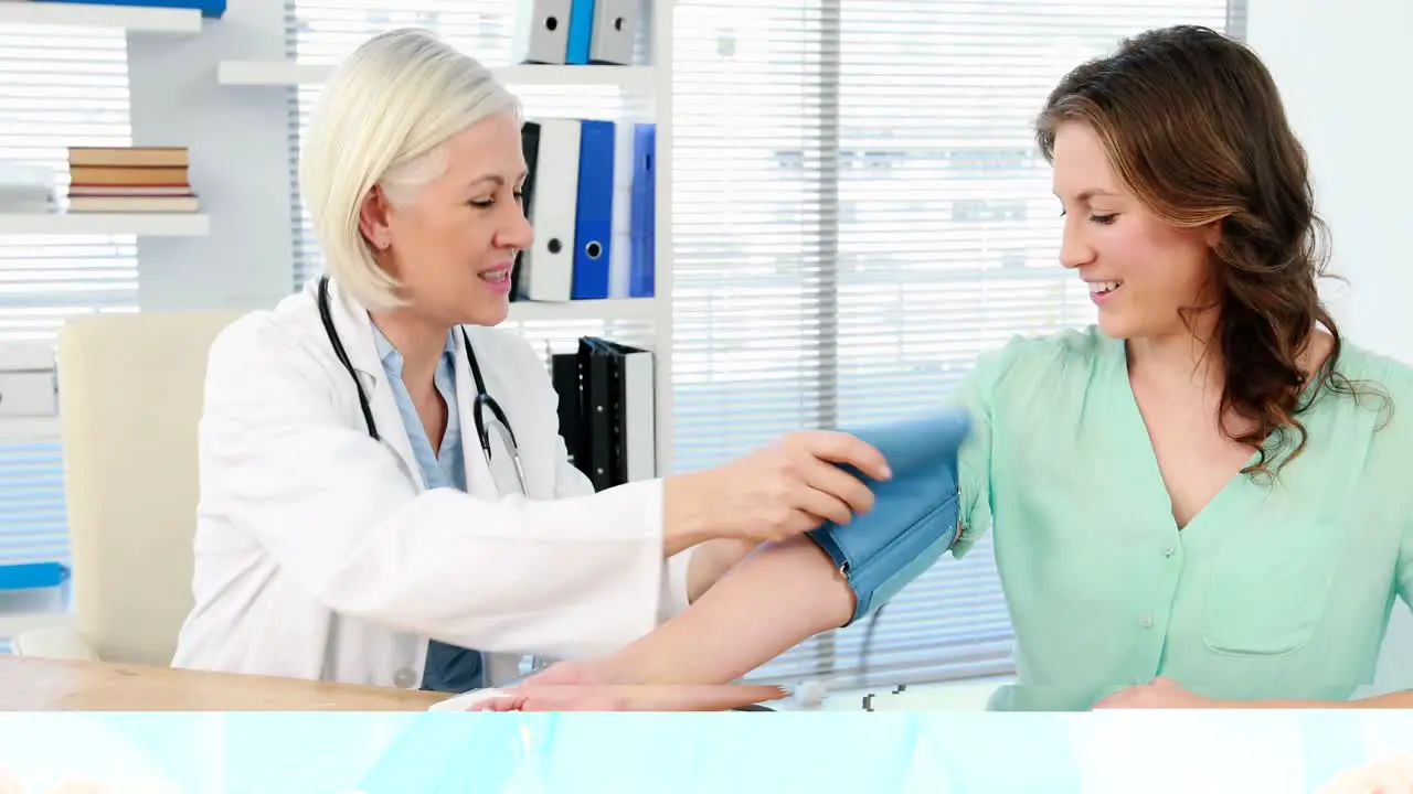 Female doctor checking blood pressure of a patient