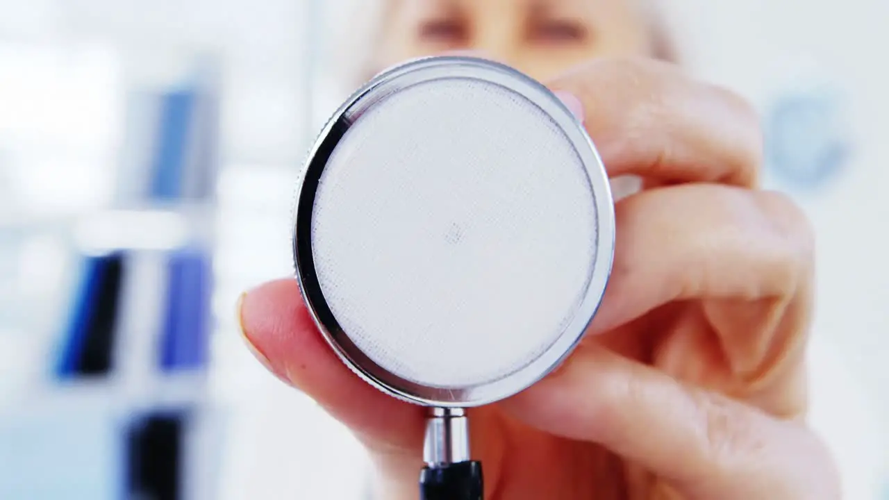 Close-up of female doctor holding stethoscope