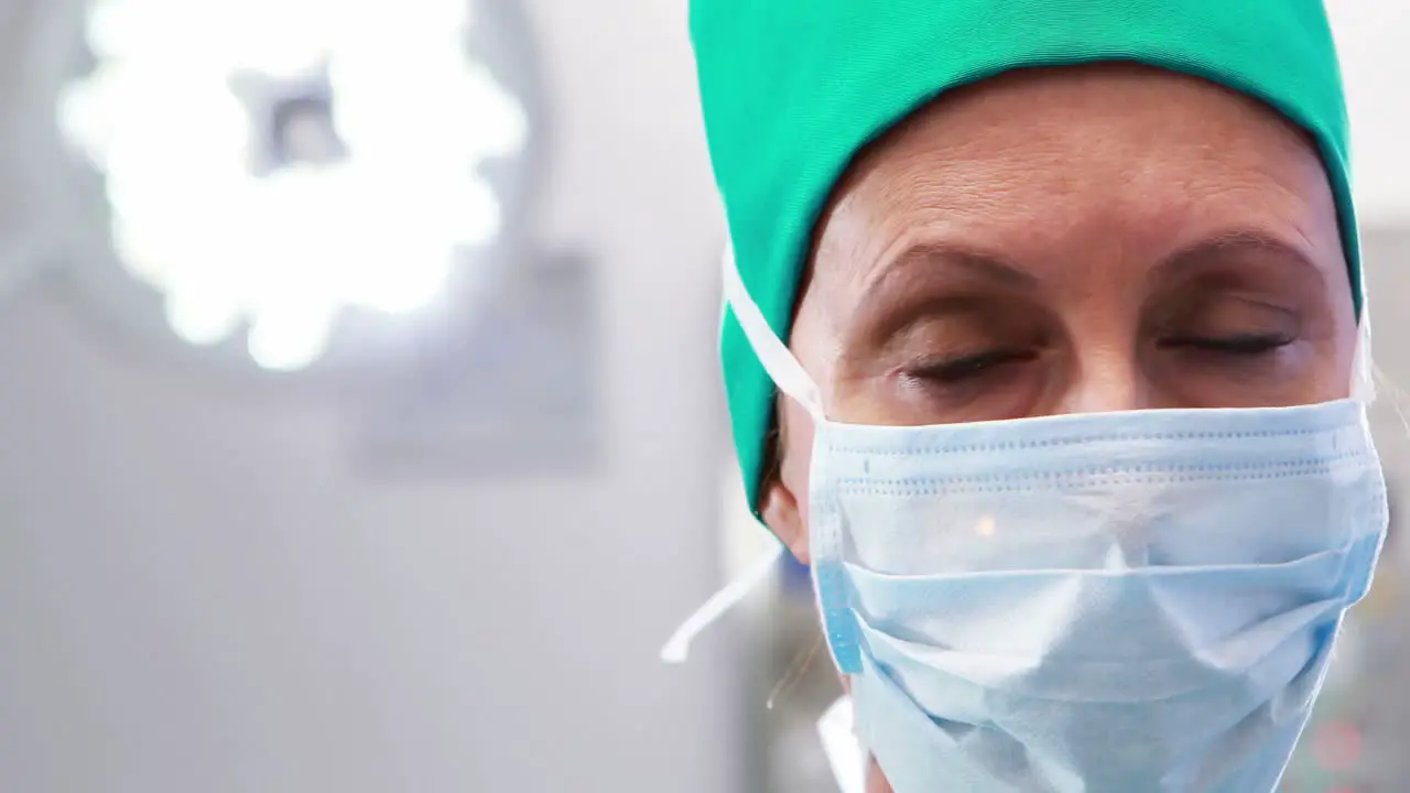 Female nurse in surgical mask at operation theater